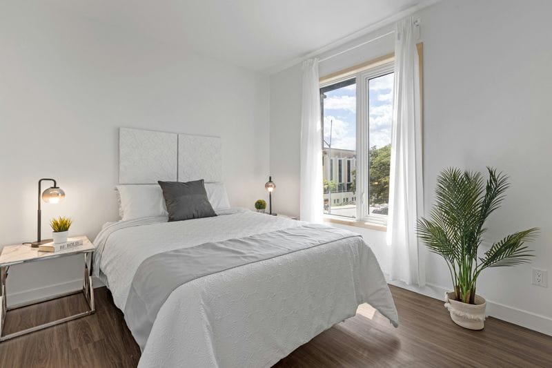 Representative bright bedroom with large window